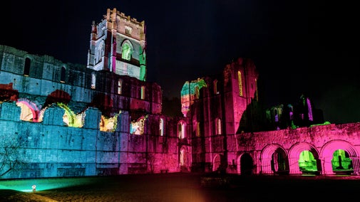 The Christmas Music and Lights event at Fountains Abbey shows the ruins illuminated